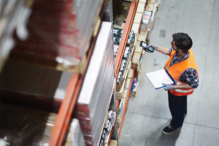 warehouse employee scanning inventory