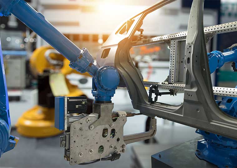 factory robot arm in automotive manufacturing plant